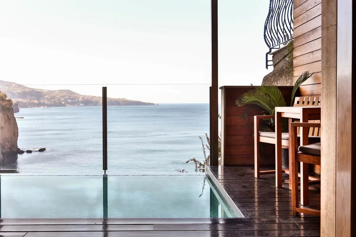 A private balcony with hardwood floors, plunge pool and beautiful ocean view