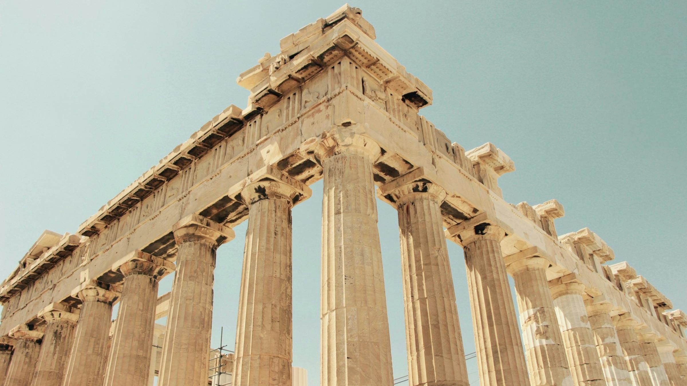 Low-angled view of a corner of the Acropolis with its many pillars